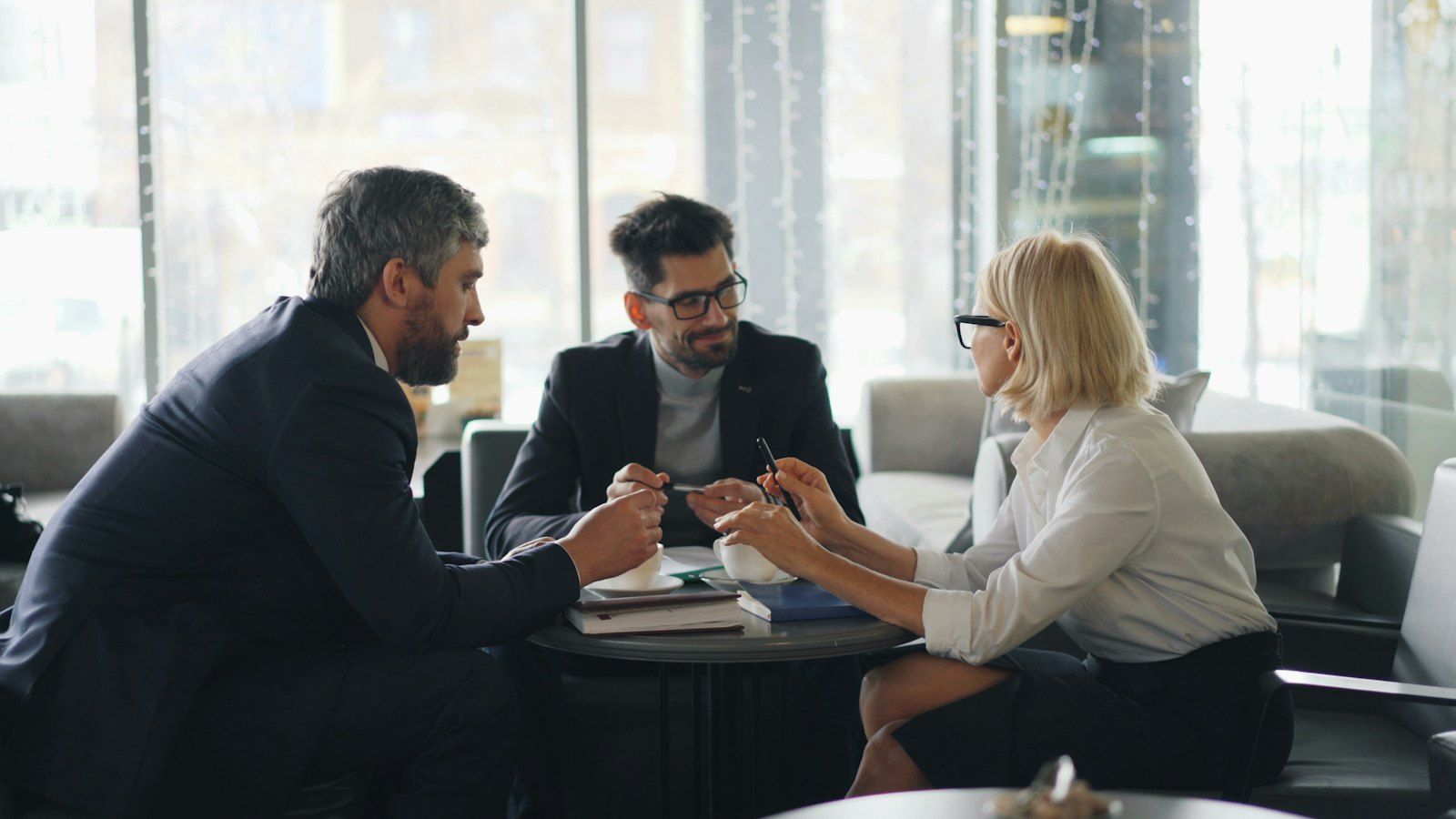 An SAP consultant in a meeting with clients